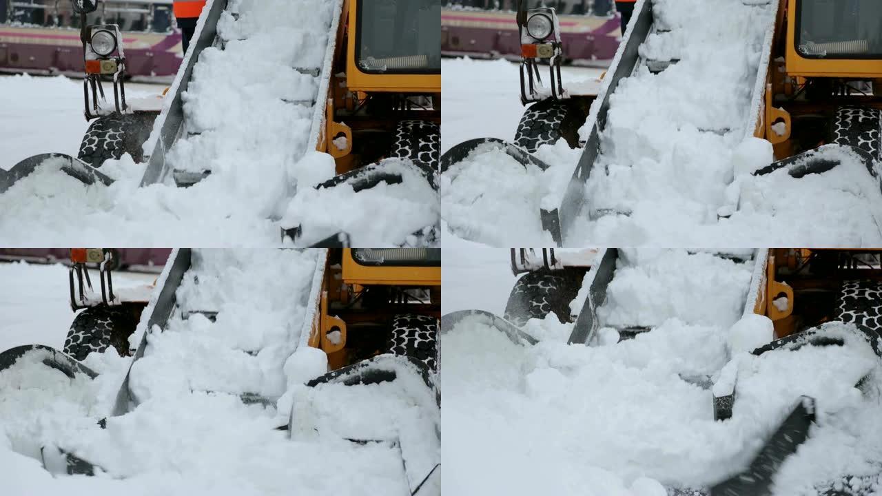 工人和专门的除雪设备清除了街道上的积雪。