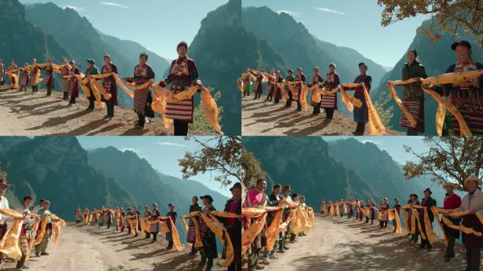 藏族人民手持哈达夹道欢迎唱歌