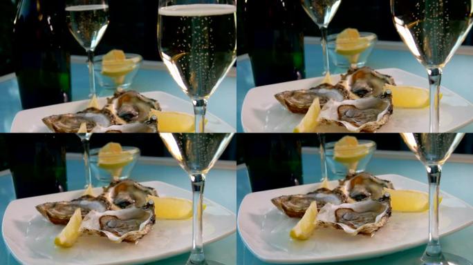 白葡萄酒杯和一盘牡蛎