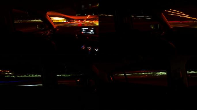 4k平移运动夜间在高速公路路口行驶的长曝光光线的时间流逝，从车内拍摄