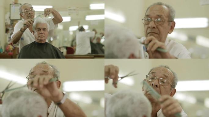 老人在男士美容院为客户理发