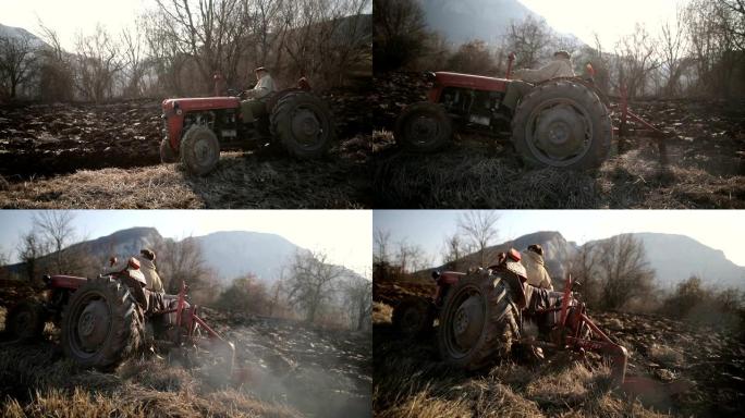 高级男子驾驶小型拖拉机和耕地。农业活动，污染，烟雾