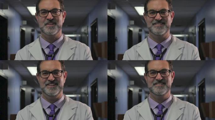 一位英俊的男医生在诊所微笑着看着相机的肖像