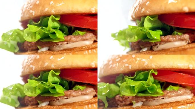 极端特写新鲜绿色生菜多汁开胃汉堡旋转镜头白色背景