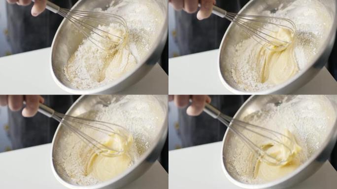 女人准备自制煎蛋卷和打蛋器混合的慢动作作物镜头。