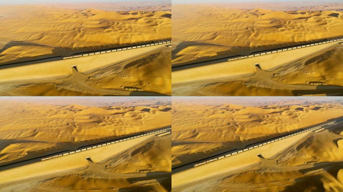 U.A.E穿越广阔沙漠的长火车的鸟瞰图