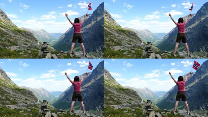 Trollstigen地区带有挪威国旗的游客