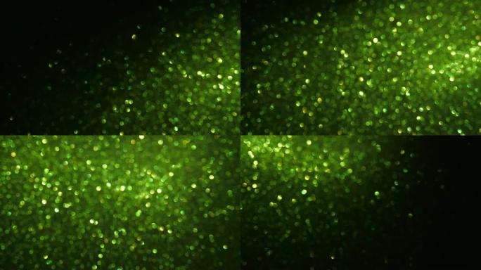 绿色颗粒背景。粒子不同运动的闪光系列。版本8