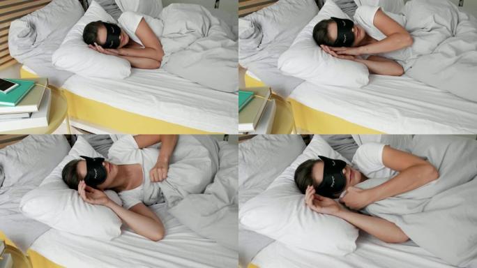 戴眼罩睡在卧室的女人