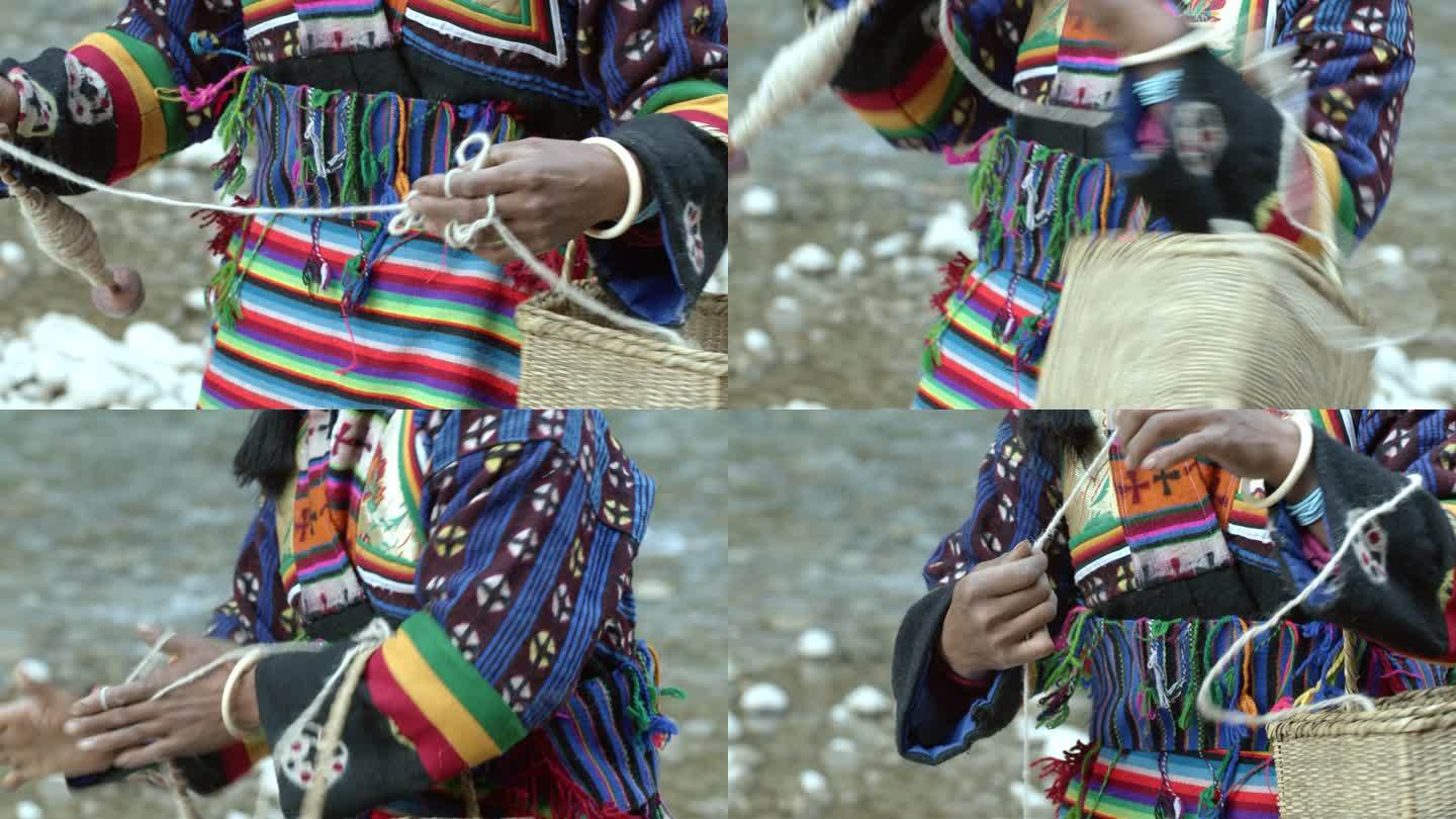 藏族妇女纺线劳作