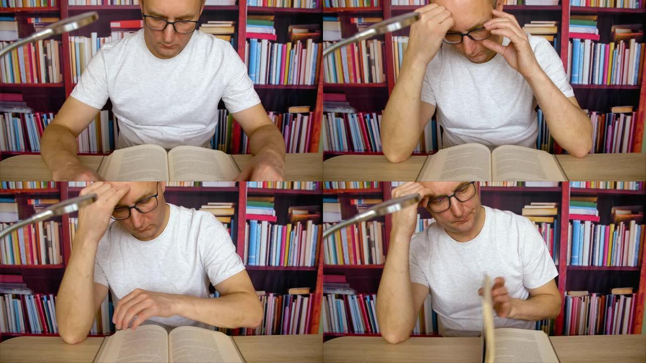 专注于眼镜的人看书坐在家里图书馆的桌子旁，带灯