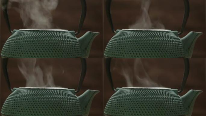 带有蒸汽的绿色传统茶叶柜