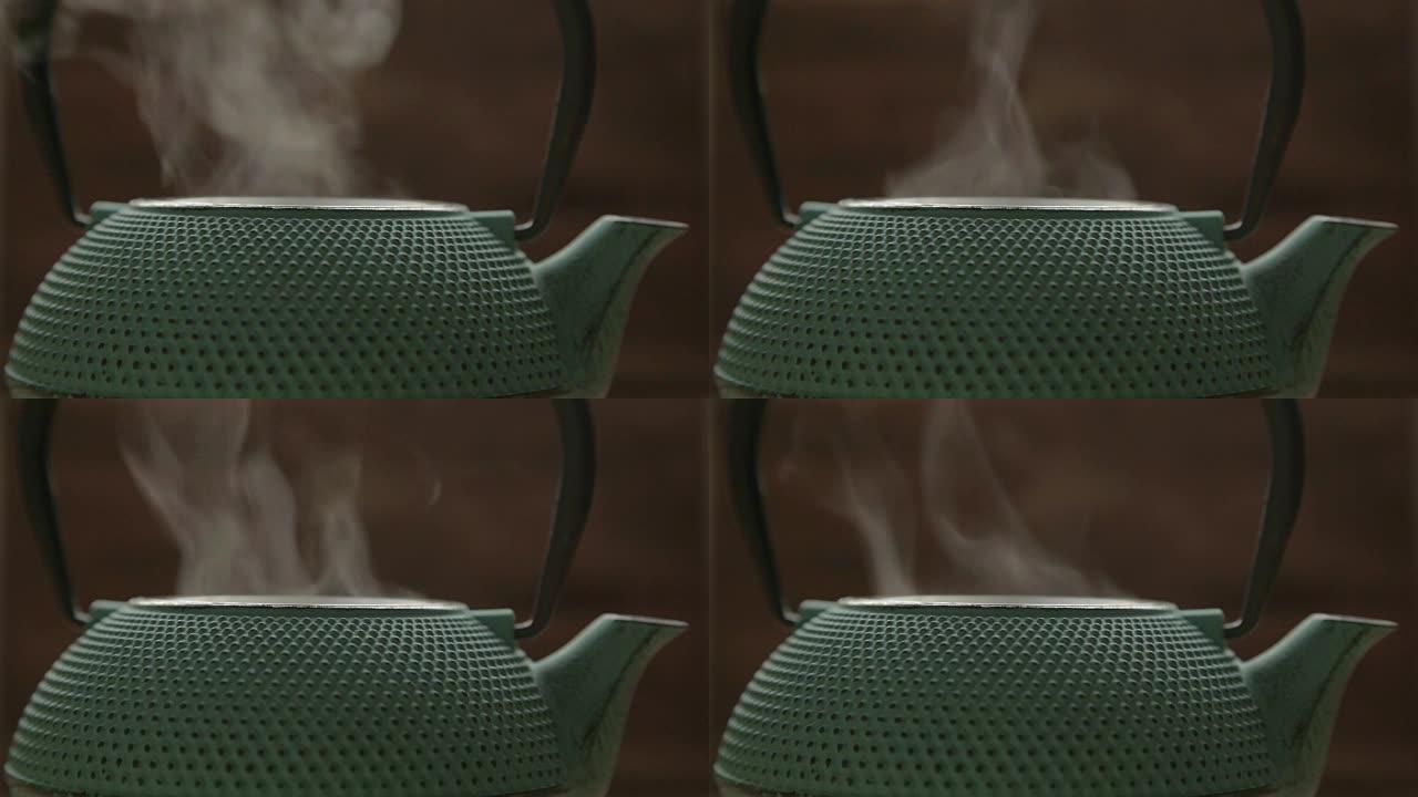 带有蒸汽的绿色传统茶叶柜