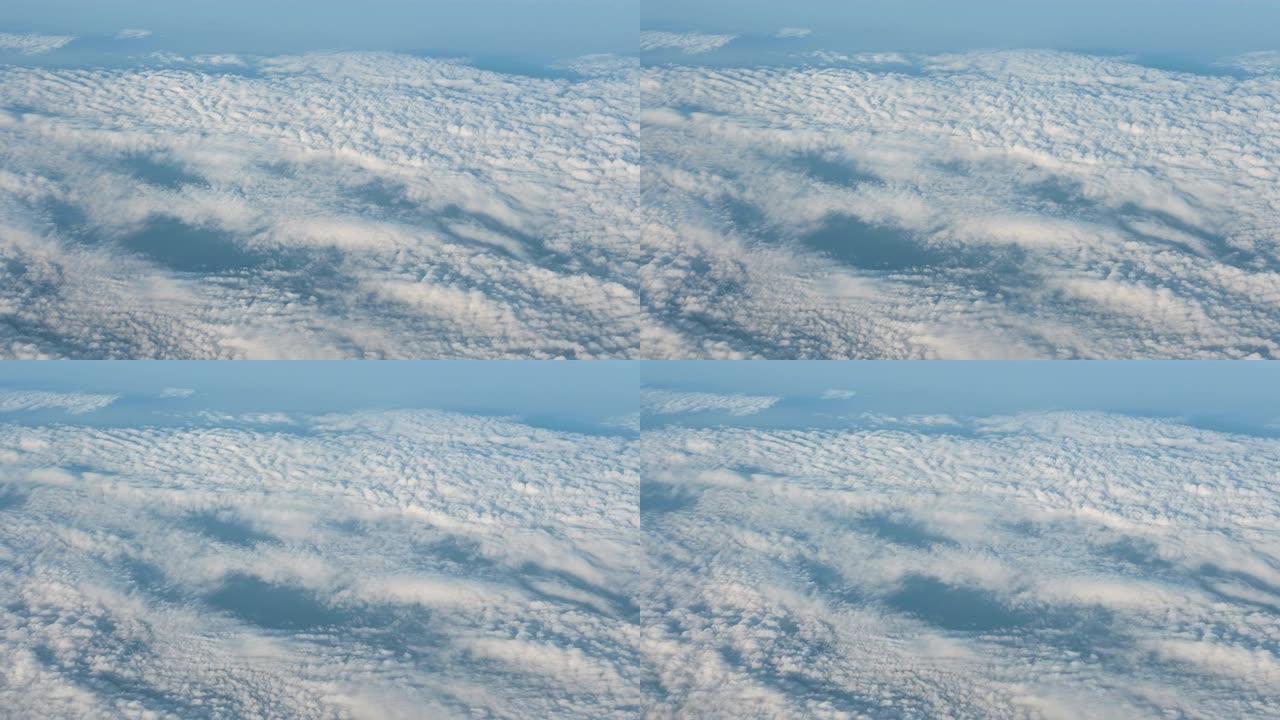 通过云层上方的飞机窗口观看4k视图