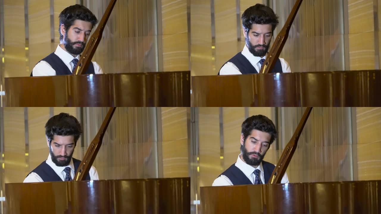 英俊的大胡子钢琴家演奏钢琴的特写镜头，欣赏演奏演奏的演奏家音乐