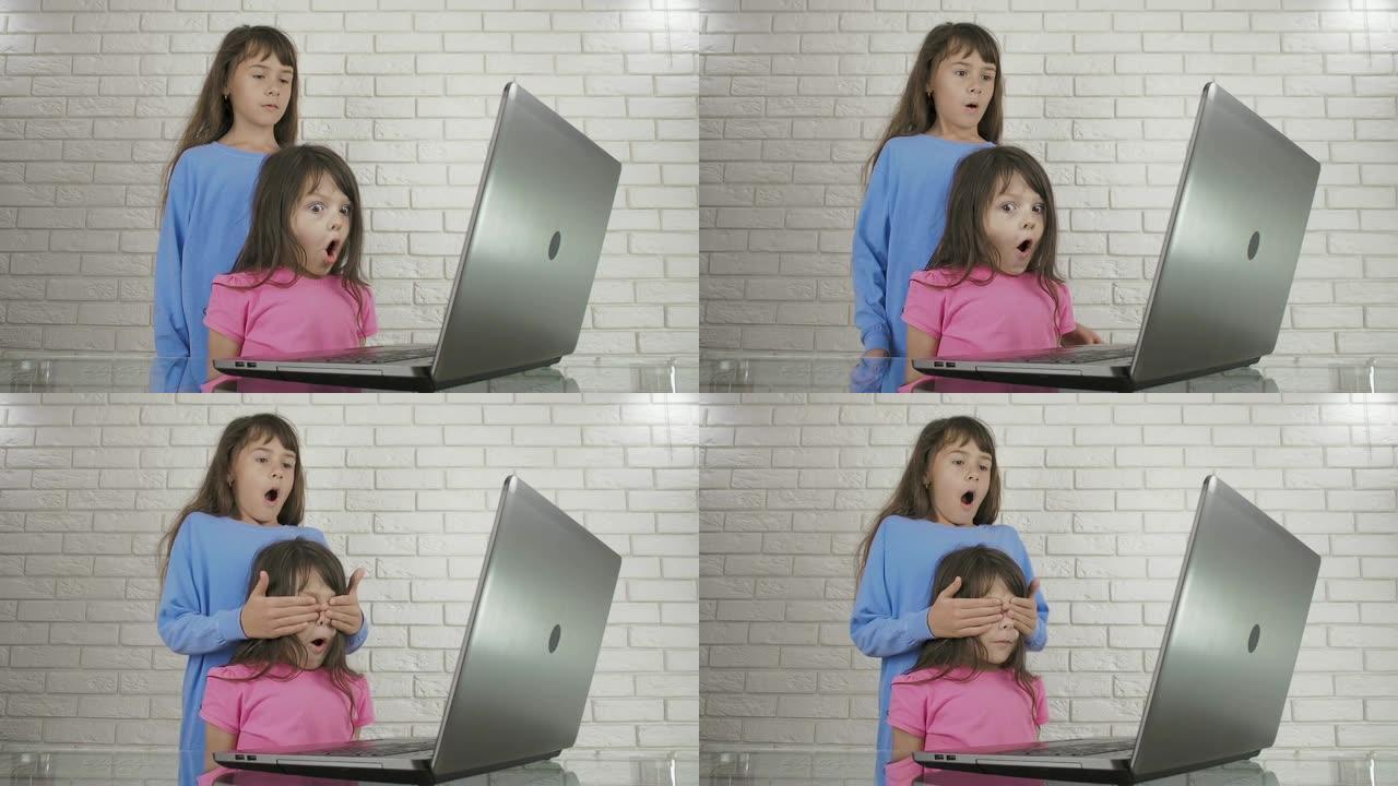 在电脑前吓唬孩子。