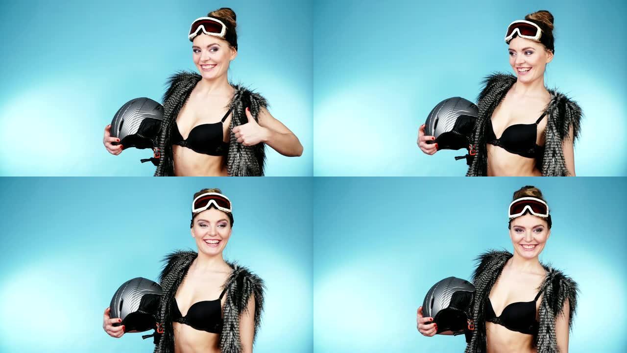 穿着滑雪护目镜的女人诱人的女孩戴着头盔。4K