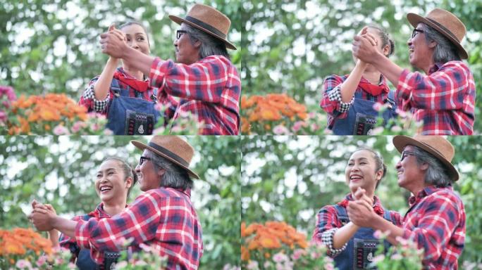 亚洲老年夫妇在家里的花园里一起跳舞。家庭，快乐，健康，环境，退休后的爱好。慢动作