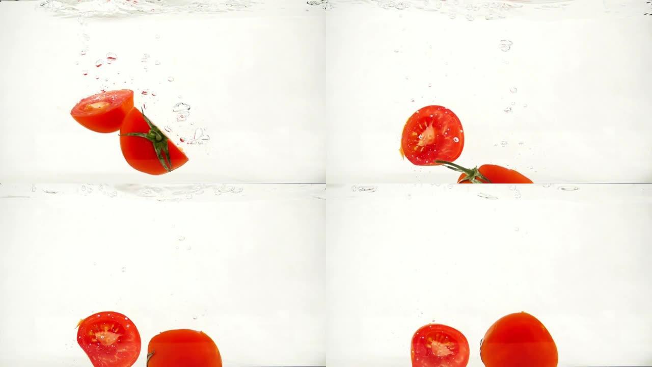 切蔬菜西红柿用气泡迅速沉入水中，慢动作特写