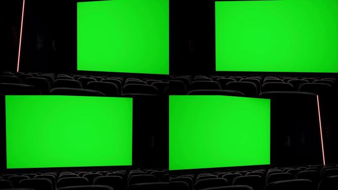 电影院内部，带空白电影院屏幕，带绿屏和空座位。电影娱乐概念。