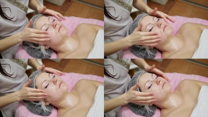 水疗女性面部按摩。美容水疗沙龙的面部按摩。女性在美容水疗中心享受放松的面部按摩。身体护理，皮肤护理，
