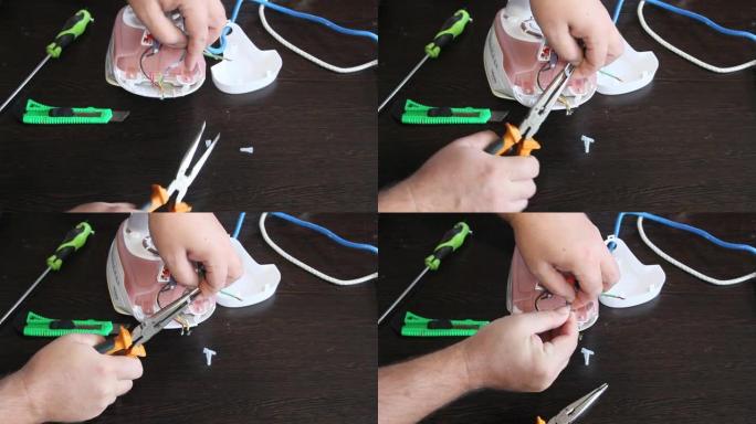 一个人修理电熨斗。