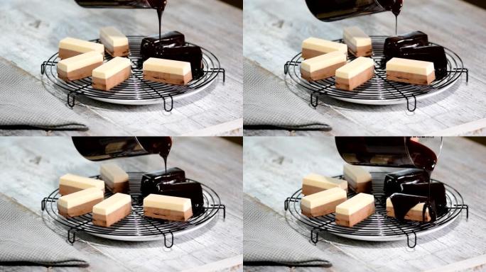 泡沫蛋糕上的巧克力糖霜。现代法国慕斯蛋糕配巧克力镜面釉。
