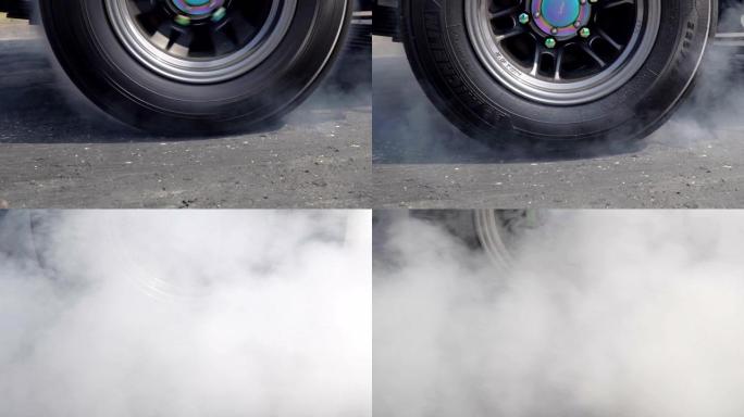 赛车在轮胎上燃烧橡胶，为比赛做准备
