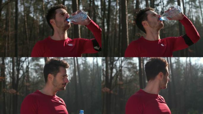 男子喝水并在艰苦锻炼后休息