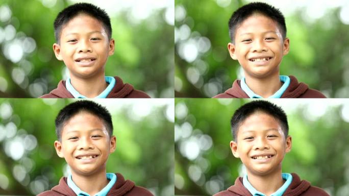 亚洲小男孩笑的特写镜头，慢动作