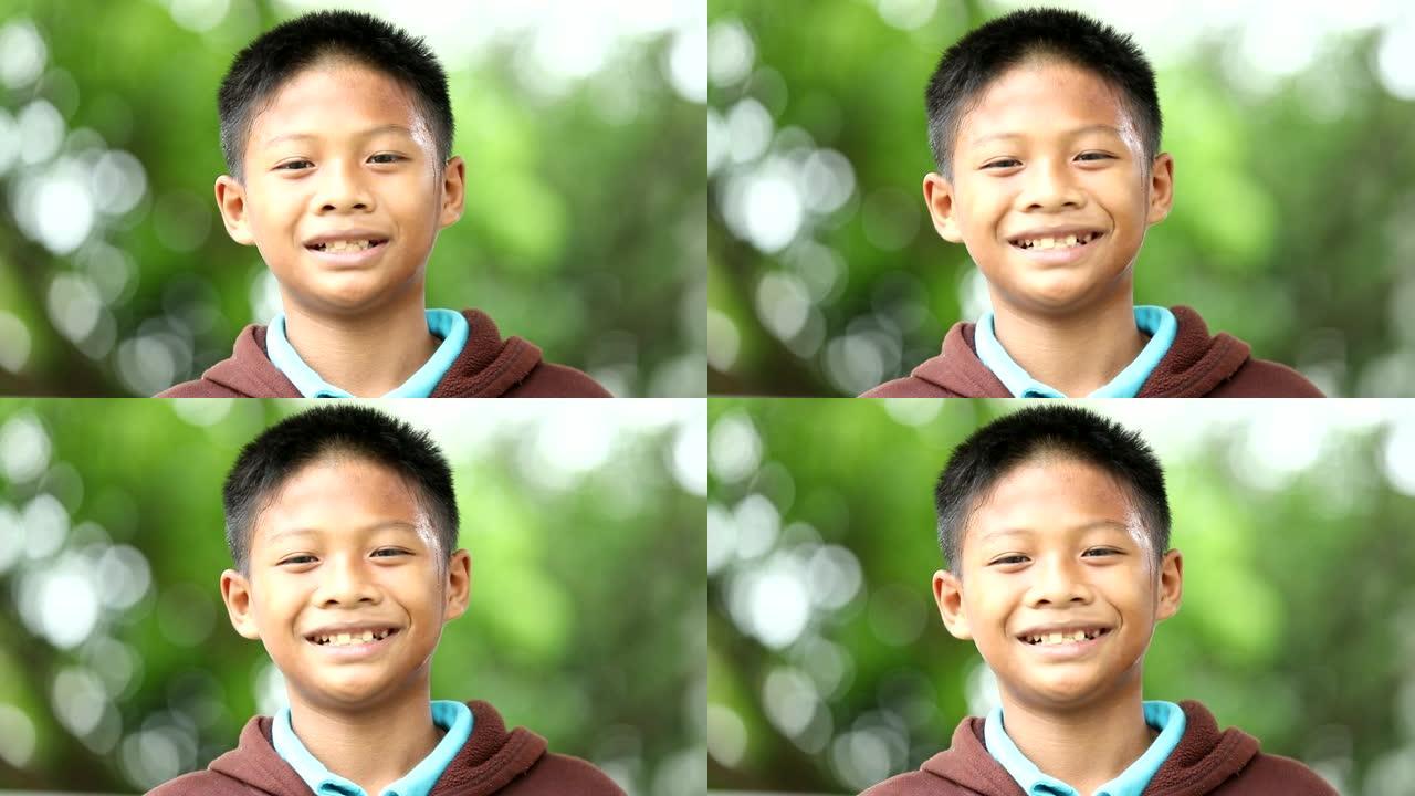 亚洲小男孩笑的特写镜头，慢动作