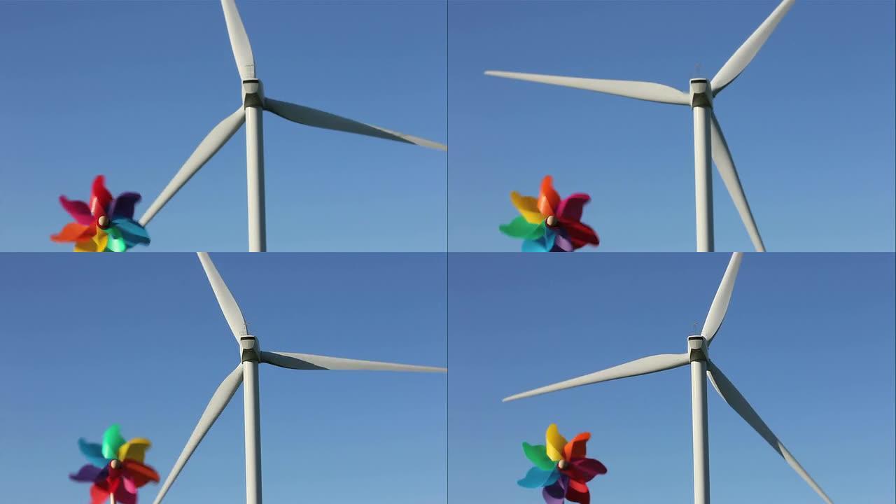 风力涡轮机和儿童风车对抗蓝天