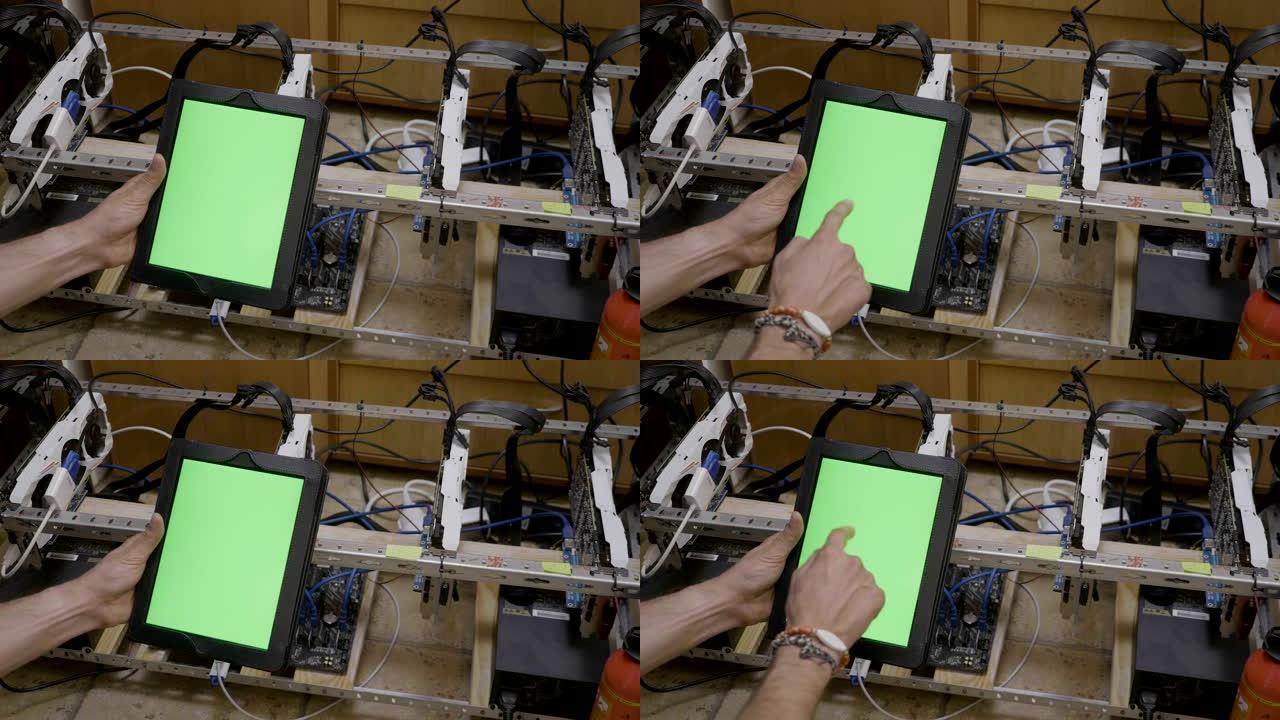 在检查加密货币采矿设备的进展后，年轻的交易员拿着色度键绿色屏幕显示ok标志的平板电脑