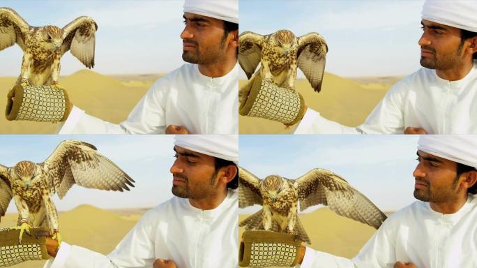 阿拉伯男性传统服装展示训练有素的猎鹰