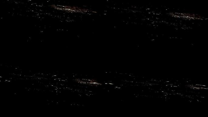 4k镜头arial视图飞行的airlpane穿过夜光城市场景伦敦