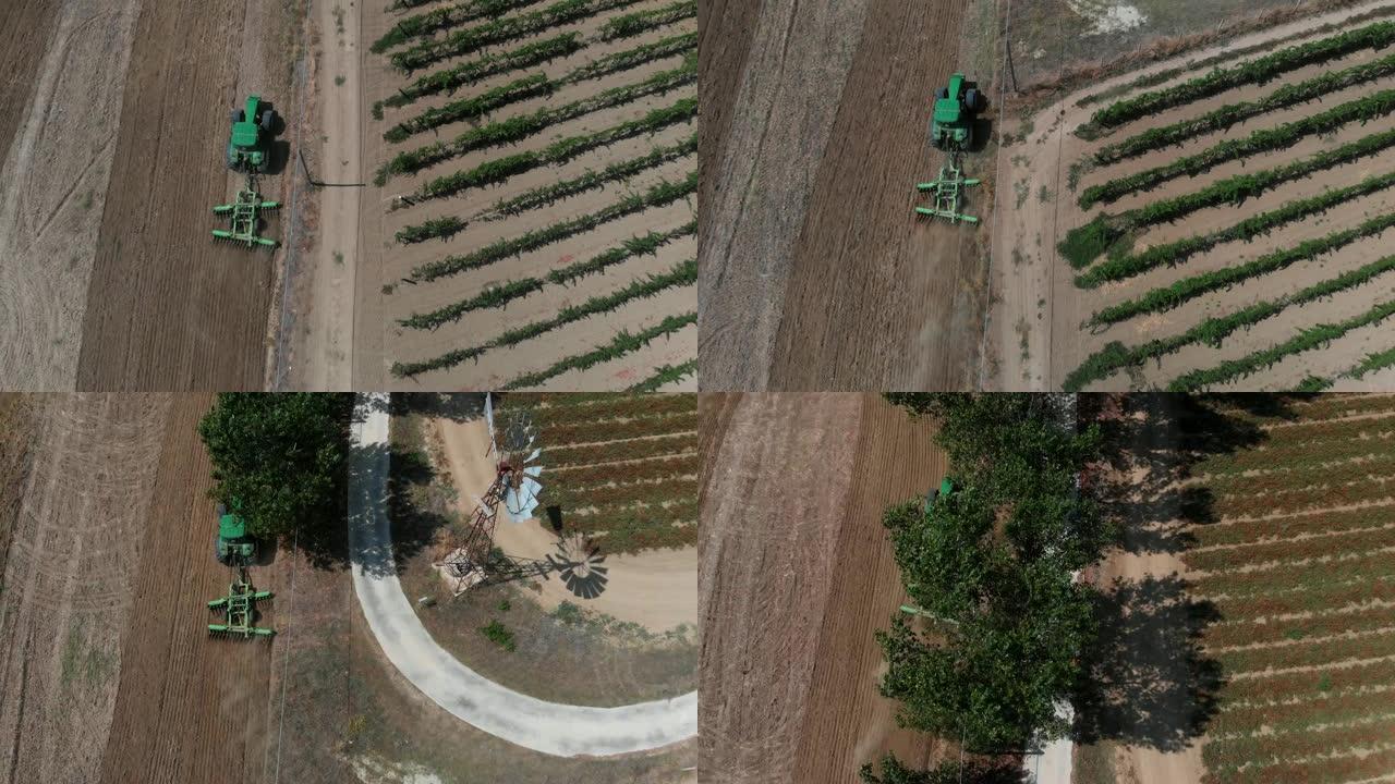 拖拉机犁番茄田的鸟瞰图。农业，技术，食品