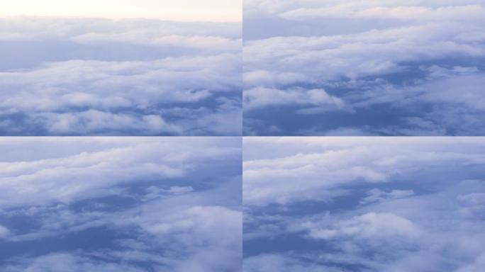 从窗户飞行的飞机看天空中的空中景观白云。多云的复制空间。飞行时从飞机窗口观看多云的天空