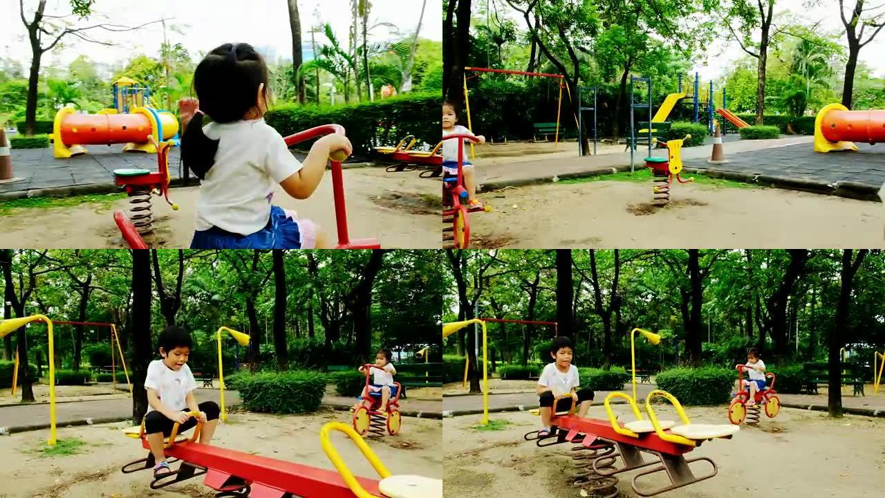 下午，一个男孩和一个女孩在公园的操场上玩耍，他们快乐而快乐。