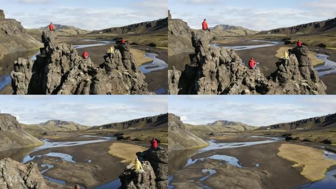 冰岛悬崖上的一群人的航拍