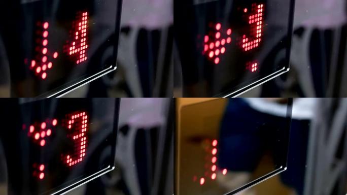 购物中心内有模糊人倒影的电梯从五层到三层的运动