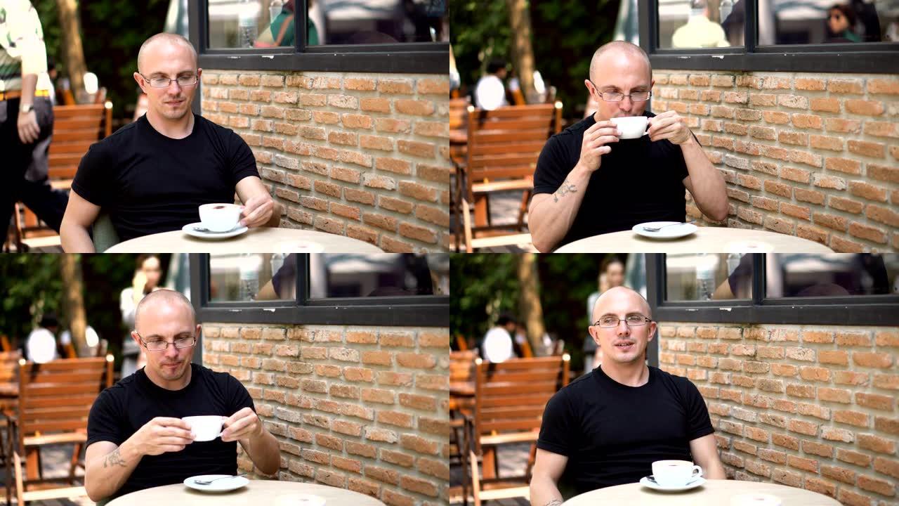 穿着随意的纯素食白人男子在东南亚的Hip Cafe户外喝大豆拿铁