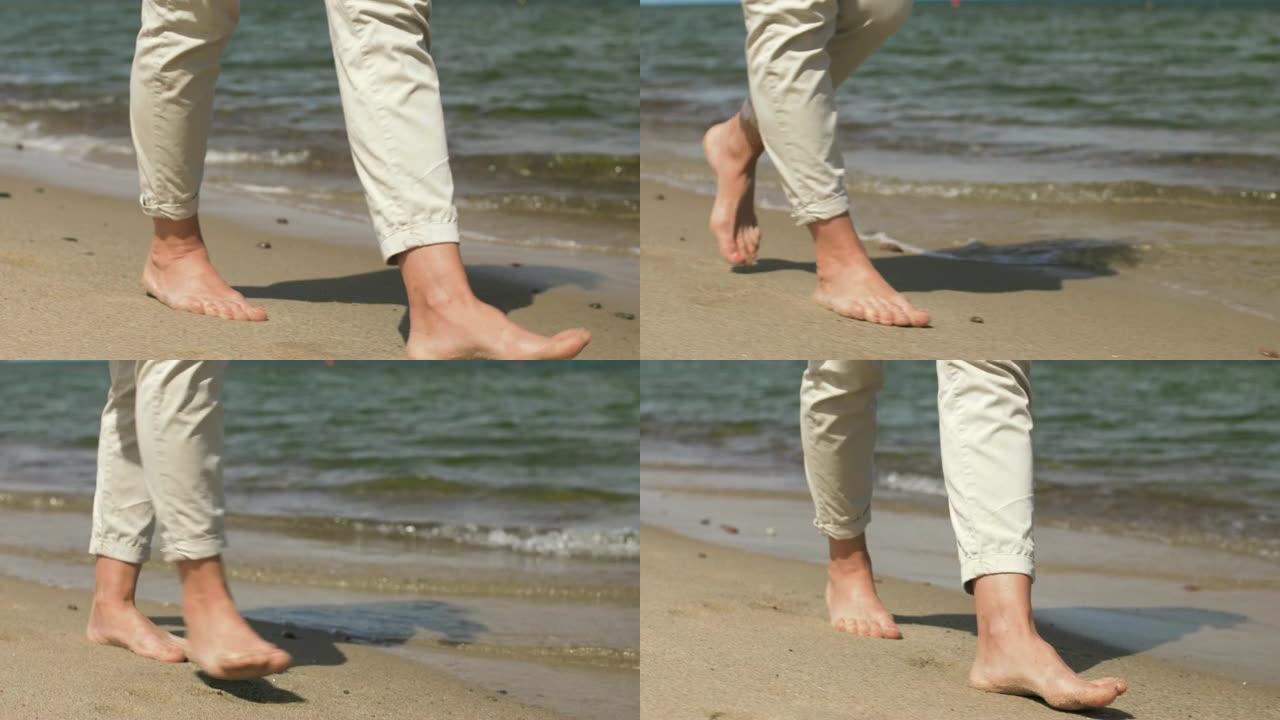 女人的脚赤脚在夏日海滩上行走