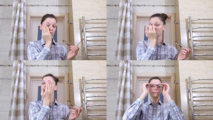 浴室里戴眼镜的昏昏欲睡的女人让自己井然有序。