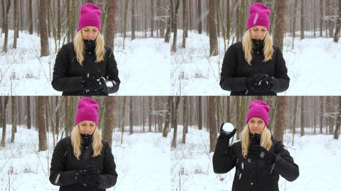 年轻的自然美女在户外白雪皑皑的森林里玩雪。