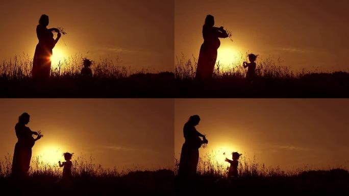 孕妇在日落时编织花圈3岁的女儿