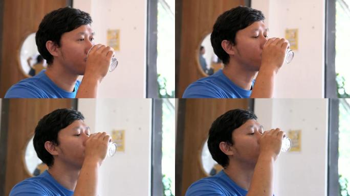 男人喝水。