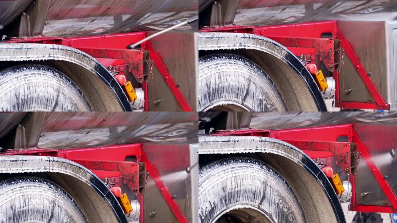 清洗特写镜头的卡车上的泡沫排水管