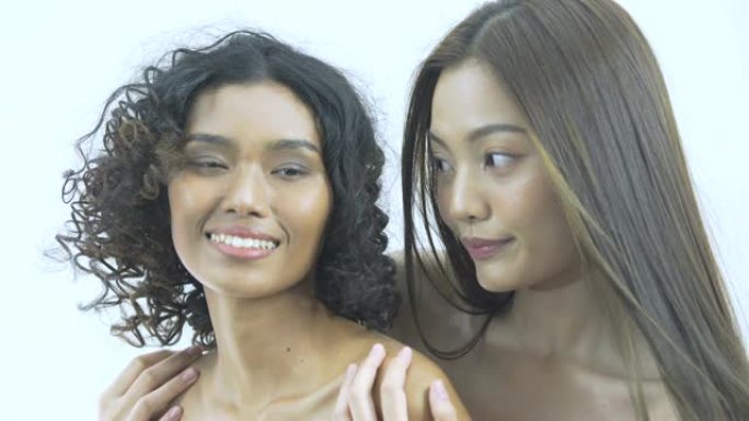 微笑的亚洲年轻女子干净清新的皮肤和美容面部护理
