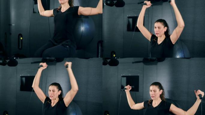 女人在健身房的电缆交叉锻炼