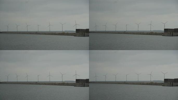主题是净发电和环境保护。若干风叶，欧洲波罗的海风力发电丹麦哥本哈根冬季
